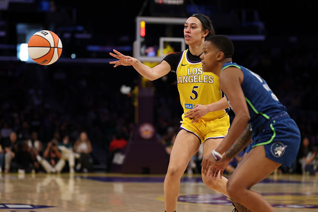 May 18, 2025; Los Angeles, California, USA; Los Angeles Sparks forward Dearica Hamby (5) passes the ball against Minnesota Lynx guard Natisha Hiedeman (2) during the second half at Crypto.com Arena. Mandatory Credit: Kiyoshi Mio-Imagn Images - Source: Imagn