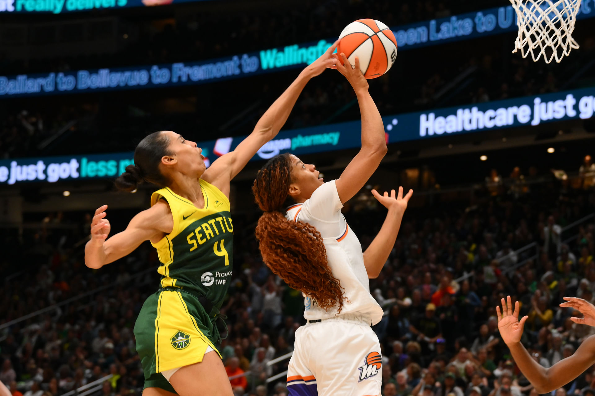 May 23, 2025; Seattle, Washington, USA; Seattle Storm guard Skylar Diggins (4) blocks a shot attempt by Phoenix Mercury guard Monique Akoa Makani (8) during the second half at Climate Pledge Arena. Mandatory Credit: Steven Bisig-Imagn Images - Source: Imagn