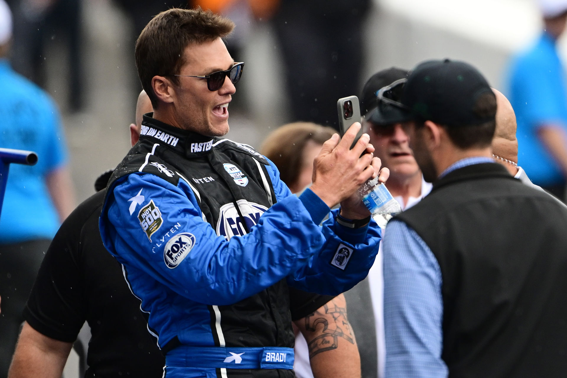 May 25, 2025; Indianapolis, Indiana, USA; Tom Brady looks on before the 109th Running of the Indianapolis 500 at Indianapolis Motor Speedway. Mandatory Credit: Marc Lebryk-Imagn Images - Source: Imagn