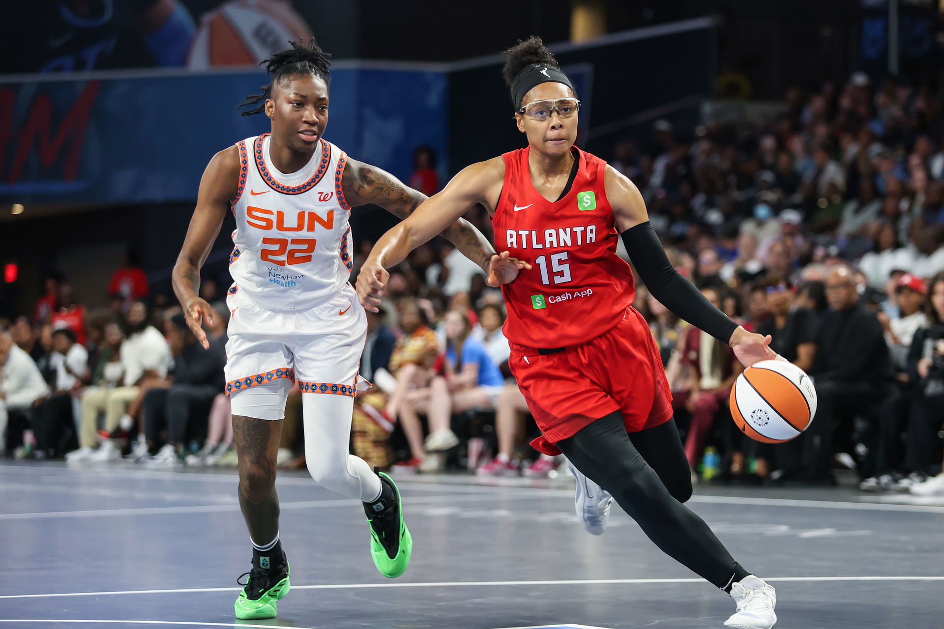 May 25, 2025; College Park, Georgia, USA; Atlanta Dream guard Allisha Gray (15) drives the ball towards the goal against Connecticut Sun guard Saniya Rivers (22) during the fourth quarter at Gateway Center Arena at College Park. Mandatory Credit: Jordan Godfree-Imagn Images - Source: Imagn