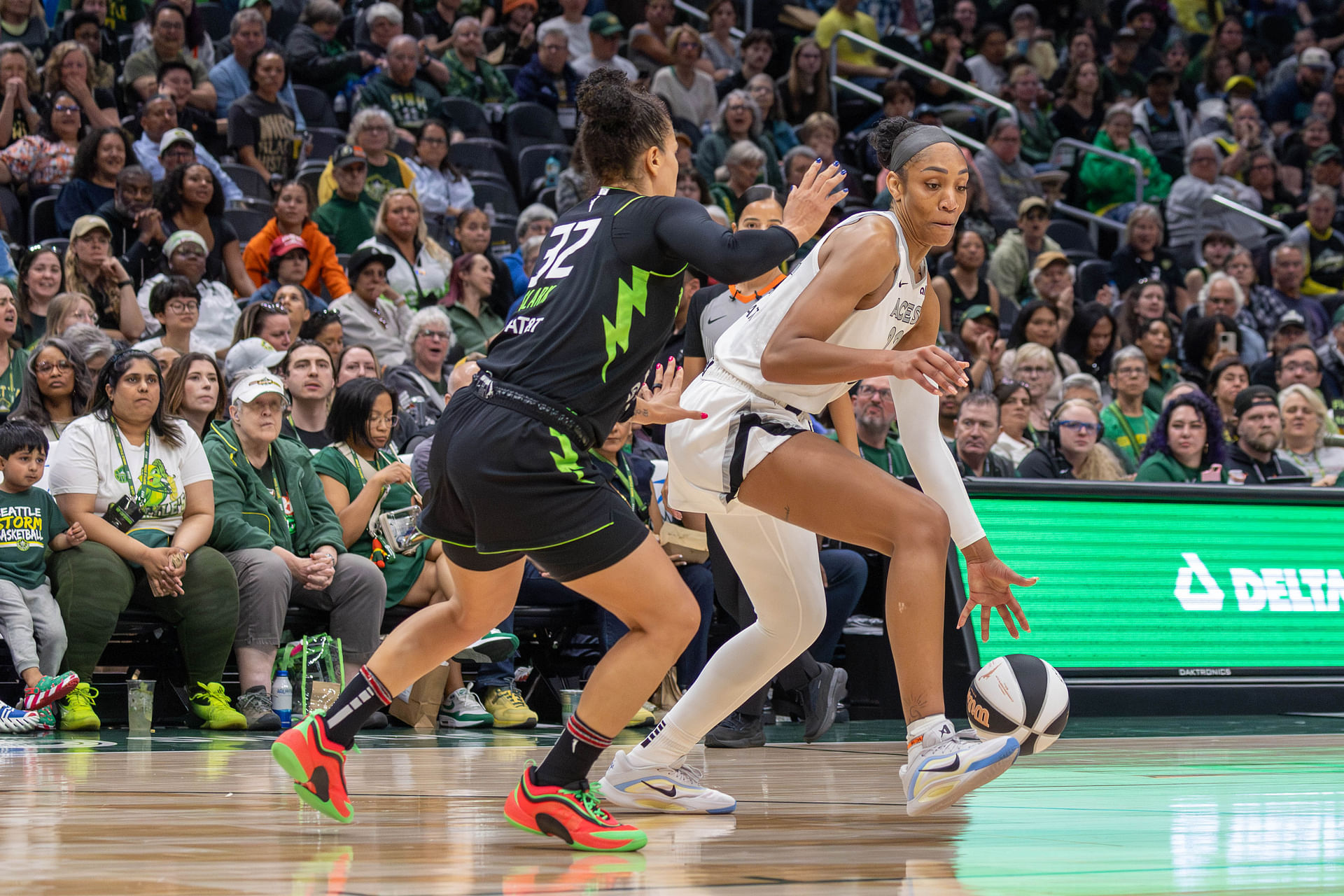 Jun 1, 2025; Seattle, Washington, USA; Seattle Storm forward Alysha Clark (32) is on defense while Las Vegas Aces center A