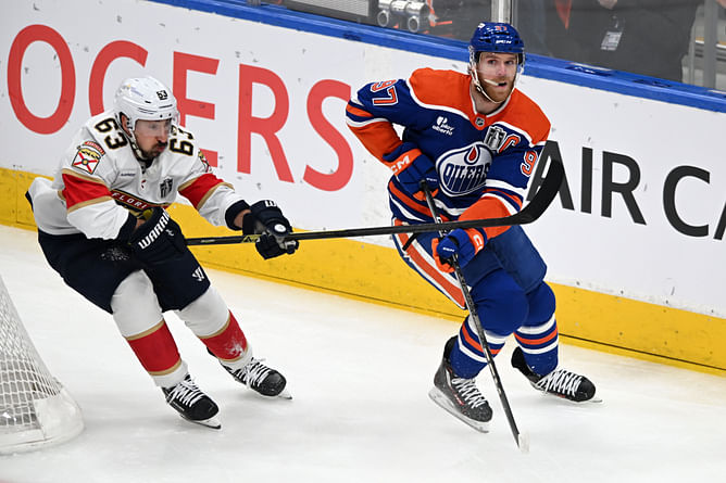 Watch: Brad Marchand and Darnell Nurse trade several body shots behind the net