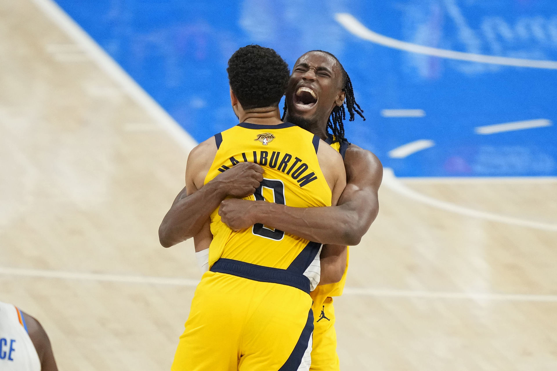 Jun 5, 2025; Oklahoma City, Oklahoma, USA; Indiana Pacers forward Aaron Nesmith (23) and guard Tyrese Haliburton (0) celebrate after a play against the Oklahoma City Thunder during the fourth quarter in game one of the 2025 NBA Finals at Paycom Center. Mandatory Credit: Kyle Terada-Imagn Images - Source: Imagn