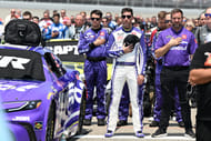 Denny Hamlin (c) and his team before the start of the FireKeepers Casino 400- Source: Imagn