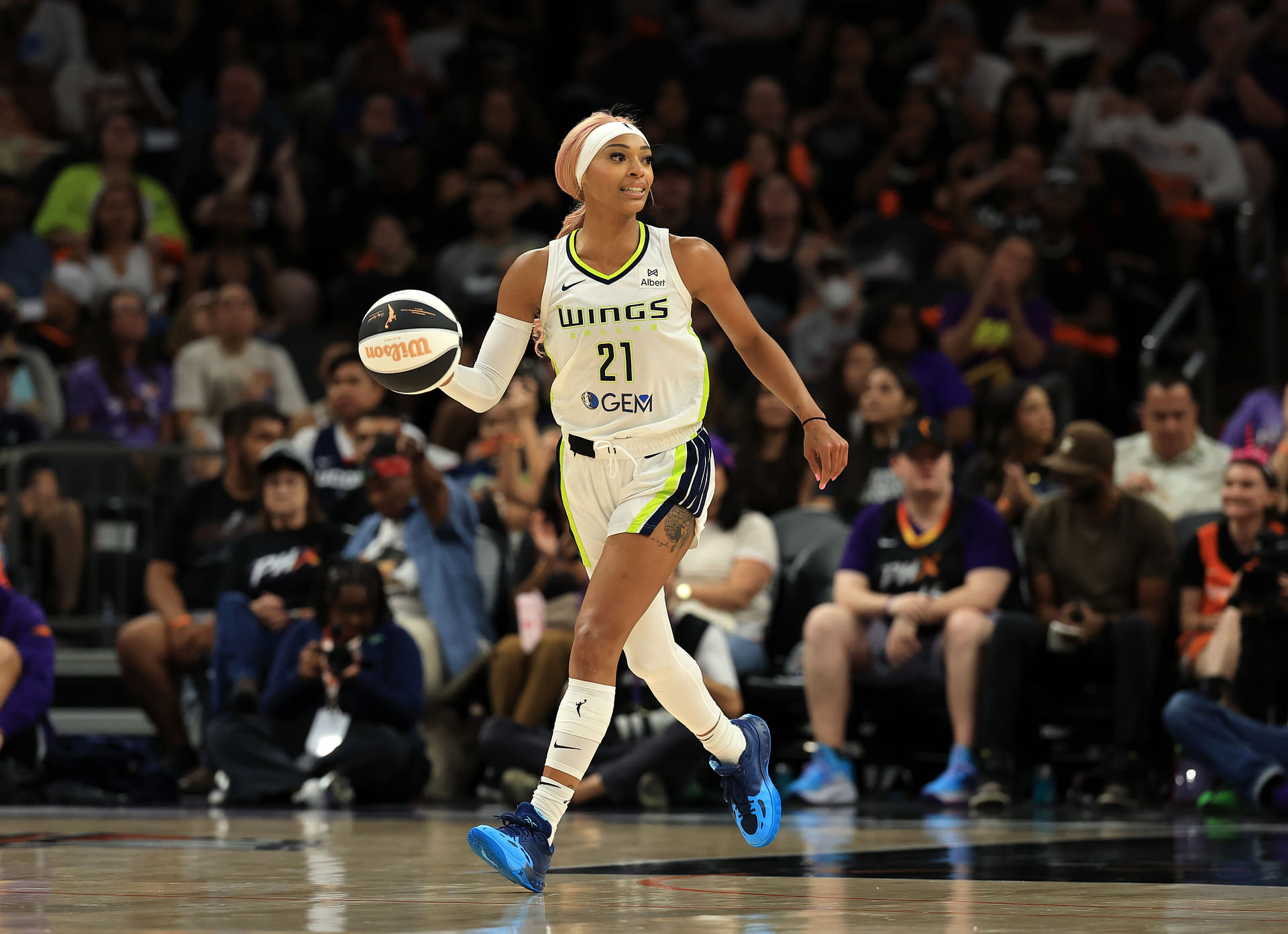 Jun 11, 2025; Phoenix, Arizona, USA; Dallas Wings guard DiJonai Carrington (21) against the Phoenix Mercury at PHX Arena. Mandatory Credit: Mark J. Rebilas-Imagn Images - Source: Imagn