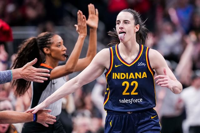 Indiana Fever guard Caitlin Clark (22) high-fives fans after scoring a 3-pointer Saturday, June 14, 2025, during a game between the Indiana Fever and the New York Liberty at Gainbridge Fieldhouse in Indianapolis. - Source: Imagn