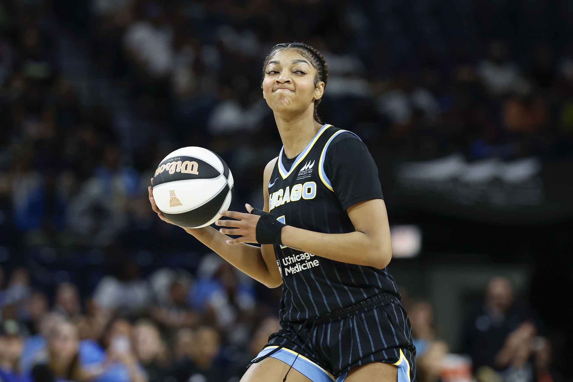 Jun 17, 2025; Chicago, Illinois, USA; Chicago Sky forward Angel Reese (5) looks to pass the ball against the Washington Mystics during the first half of a WNBA game at Wintrust Arena. Mandatory Credit: Kamil Krzaczynski-Imagn Images - Source: Imagn