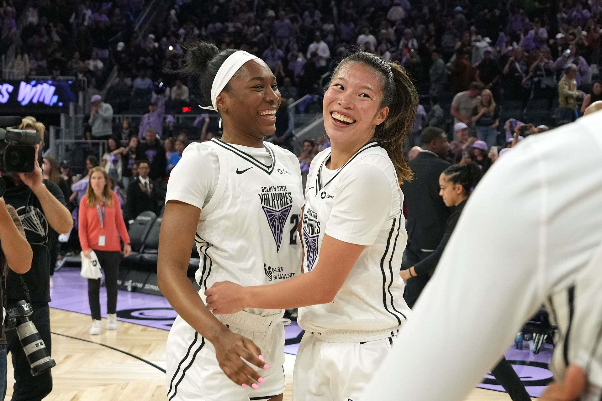 Jun 22, 2025; San Francisco, California, USA; Golden State Valkyries guards Bree Hall (center left) and Kaitlyn Chen (center right) celebrate after defeating the Connecticut Sun at Chase Center. Mandatory Credit: Darren Yamashita-Imagn Images - Source: Imagn