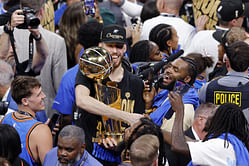 Chet Holmgren's teammates save the Larry O'Brien trophy from damage as center staggers drunkenly on stage