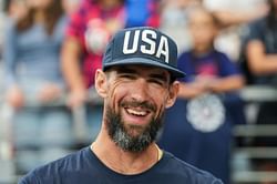 Michael Phelps reacts to an unfulfilled wish with Gunnar Henderson's trading card