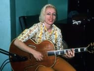 Legendary bassist Carol Kaye playing guitar. (Image via Facebook/@Carol Kaye)