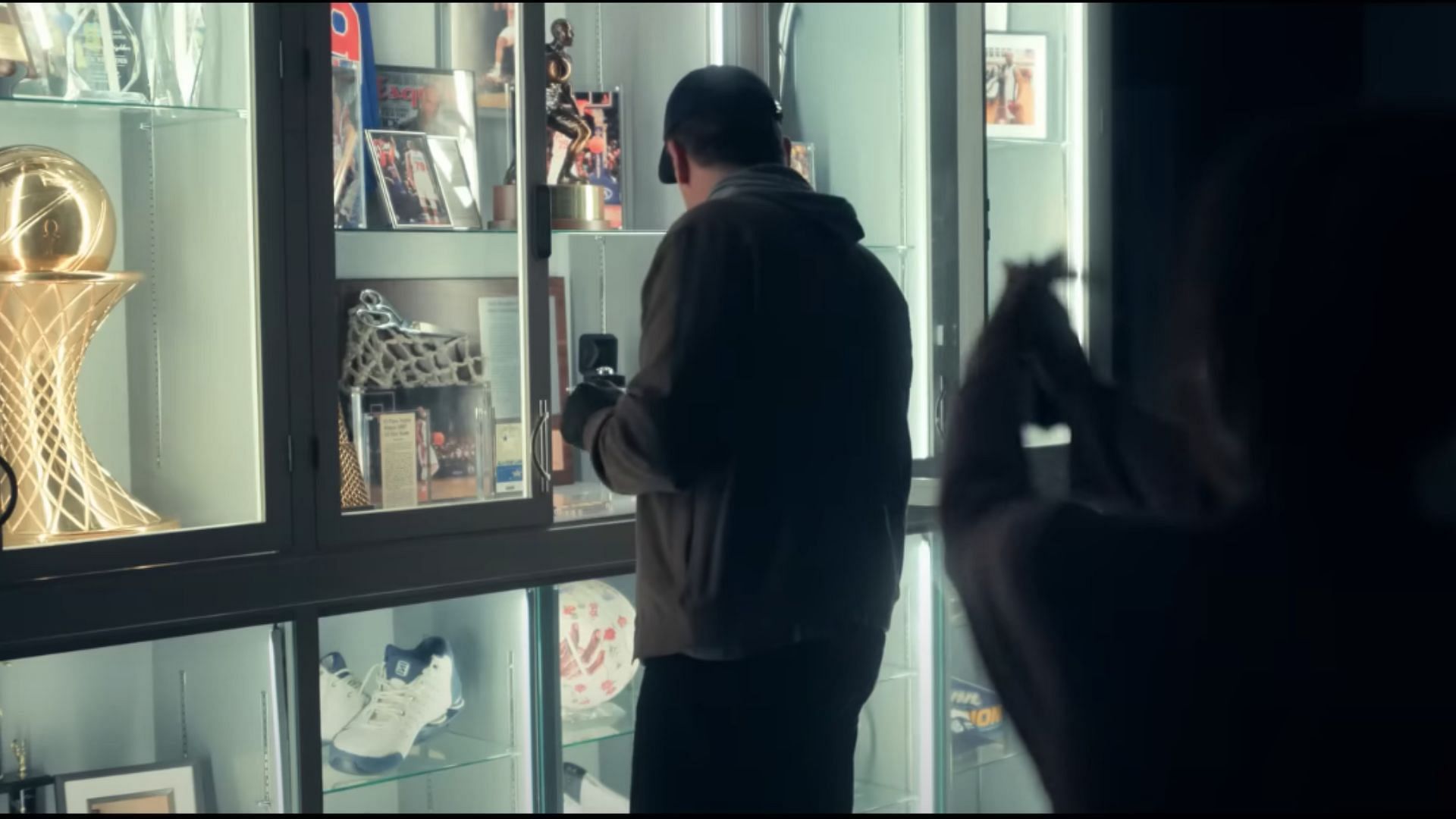 Elena holds Coop at gunpoint (Image via YouTube/Apple TV)