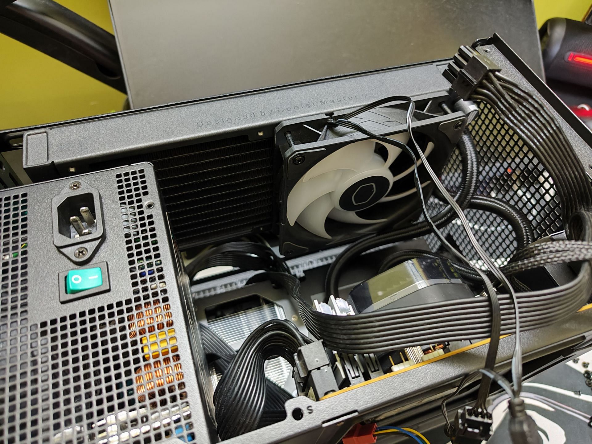 It's possible to use a 240mm water cooler with a single fan and an ATX PSU (Image via Sportskeeda)