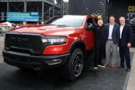 (From left) Tim Kuniskis, CEO of Ram Brand, NASCAR Executive Vice President Steve O'Donnell, and John Probst, SVP of Innovation and Racing Development at the Ram display before the NASCAR Cup Series FireKeepers Casino 400 at Michigan International Speedway on June 08, 2025 - Source: Getty
