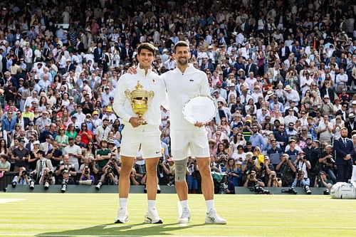 Carlos Alcaraz (left) and Novak Djokovic (right) after the conclusion of the men's singles final of the 2024 Wimbledon Championships (Source: Getty)