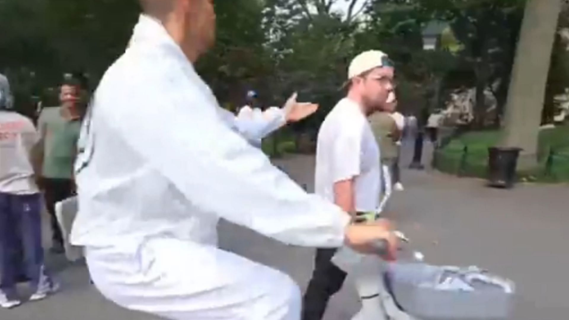 Sneako was seen pushing the hat off of a man