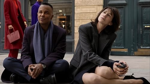 Geneviève Lavigne, played by Charlotte Gainsbourg, and Raphaël Marchand, portrayed by Yanic Truesdale, share a quiet moment outside the ballet academy in Paris. (Image via Amazon Prime)