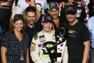 Tyler Reddick (C) with Kelley Earnhardt Miller and Dale Earnhardt Jr. in Victory Lane after winning the NASCAR Xfinity Series Ford EcoBoost 300 at Homestead-Miami. Source: Getty