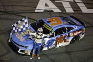 Chase Elliott, driver of the #9 NAPA/Children's Chevrolet, celebrates with the checkered flag after winning the NASCAR Cup Series Quaker State 400 Available at Walmart at Echo Park Speedway - Source: Getty