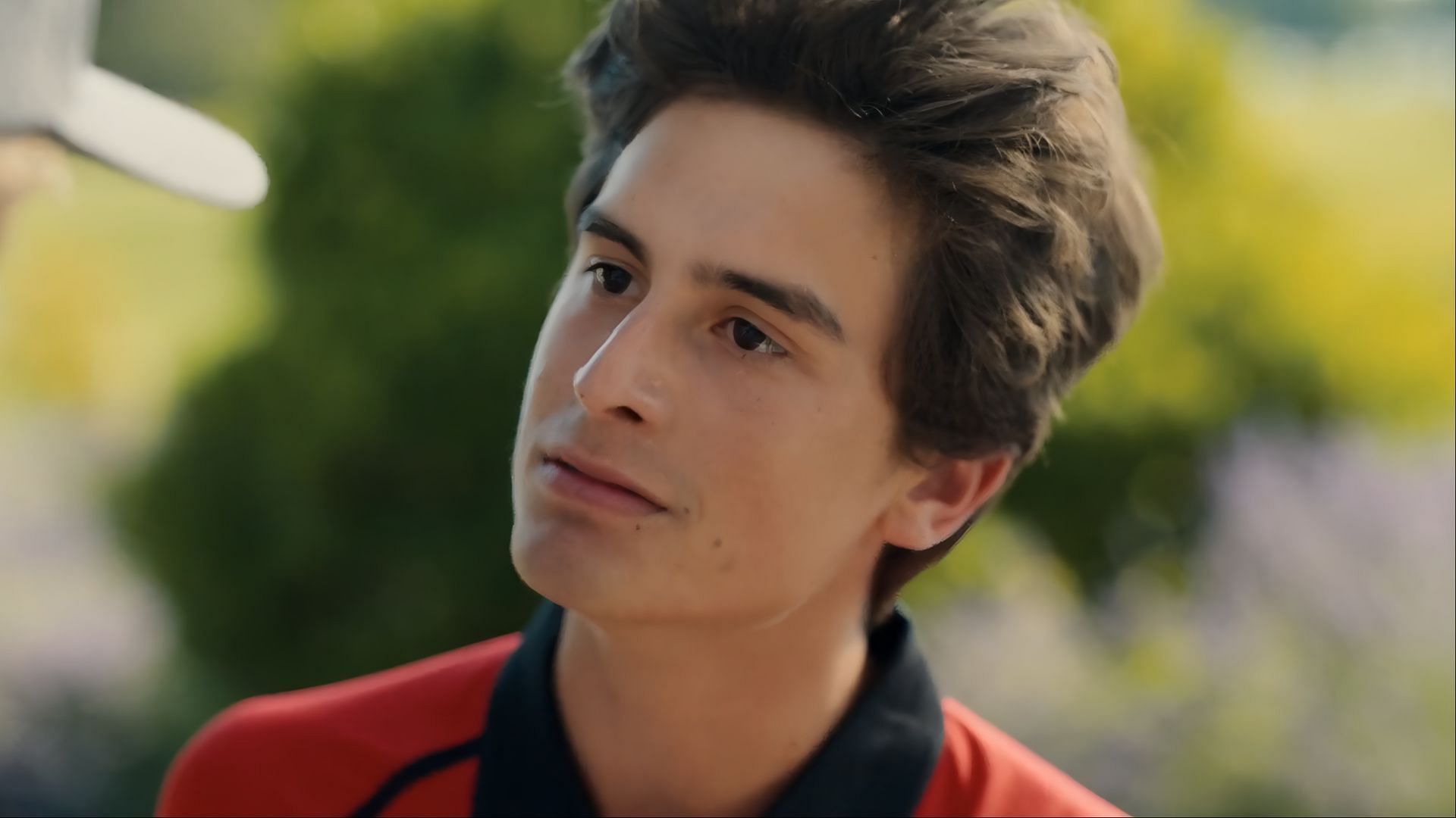 Close-up of Santi&rsquo;s emotional face during a confrontation outdoors.