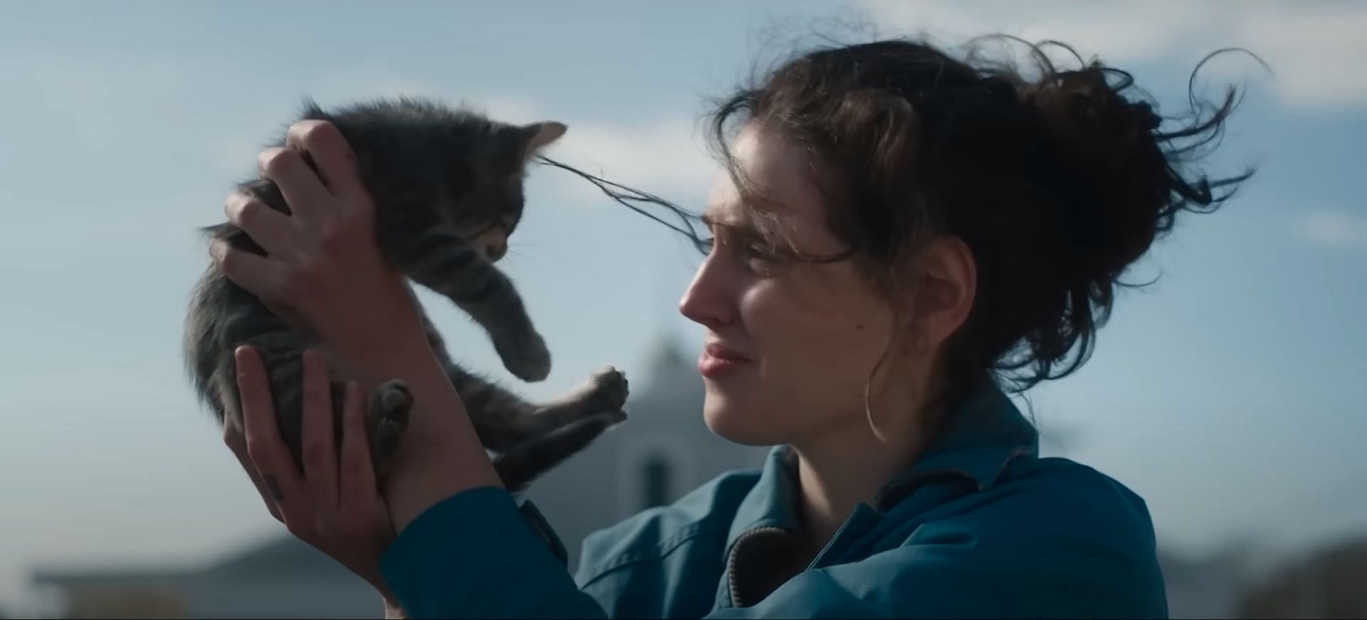 A snippet of Agnes holding a kitten as seen in the trailer for the black-comedy drama film Sorry, Baby. (Image via youtube.com/A24)