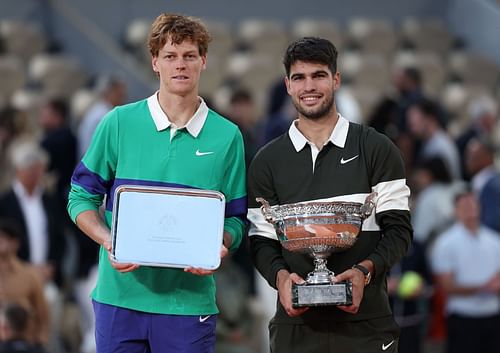Jannik Sinner (left) and Carlos Alcaraz (right) with the men's singles runner-up and winner's trophies respectively at the 2025 French Open (Source: Getty)
