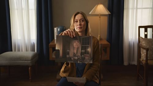 Camille Sullivan’s character holds a photograph of her missing sister, the focus of the film’s mystery. (Image via Instagram/@neonrated)