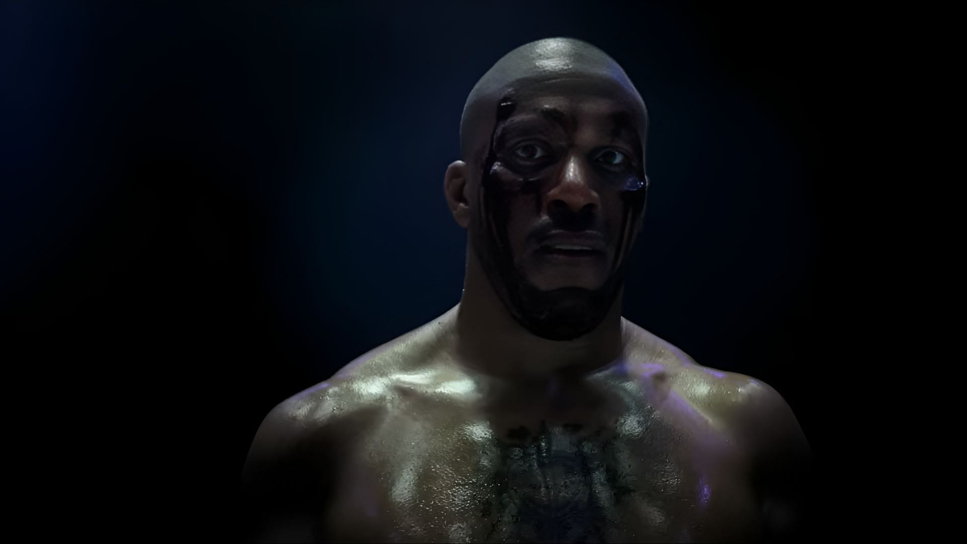 Ciryl Gane shirtless and bloodied inside the ring portraying Bastien in K.O. (2025)