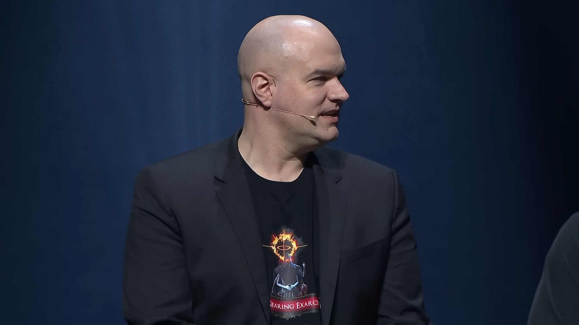 Chris during ExileCon 2023 roundtable (Image via Grinding Gear Games)