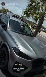 Nelly Korda shows off her new matte-gray BMW X5 M Competition parked outside Paradigm Performance (via @nellykorda)