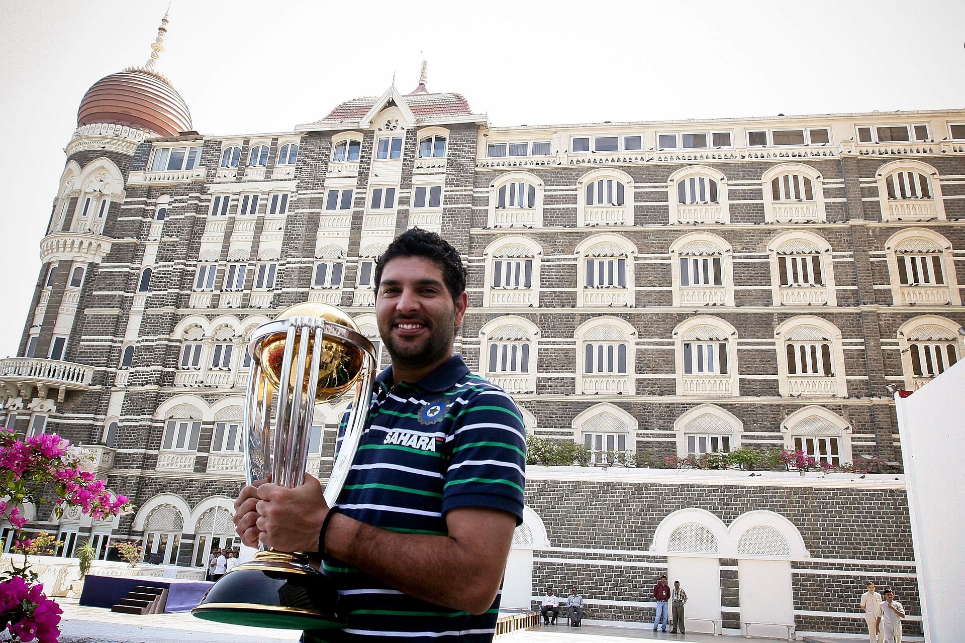Yuvraj Singh poses with the 2011 ICC World Cup trophy. [Source: Getty]
