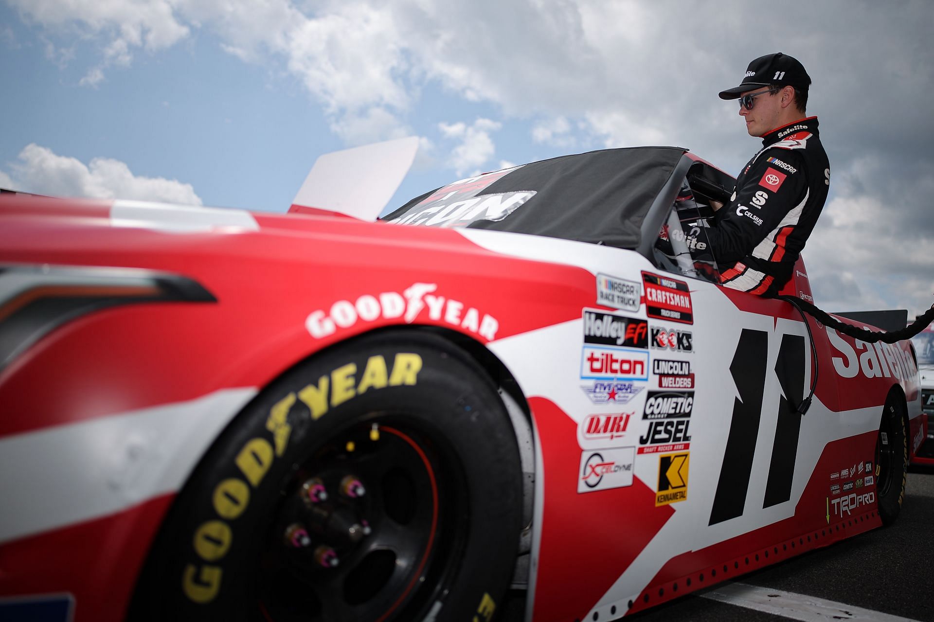 LONG POND, PENNSYLVANIA - JUNE 20: Corey Heim, driver of the #11 Safelite Toyota, enters his truck during qualifying for the NASCAR Craftsman Truck Series MillerTech Battery 200 at Pocono Raceway on June 20, 2025 in Long Pond, Pennsylvania. (Photo by Jonathan Bachman/Getty Images) - Source: Getty