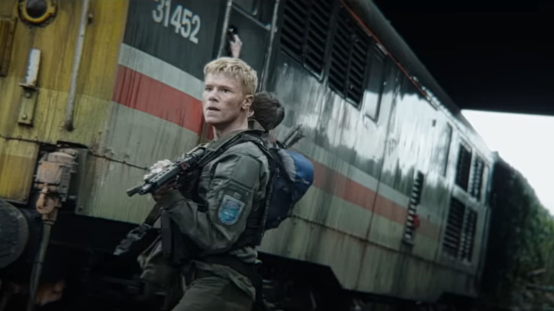 The non-infected try to fight the zombies (Image via YouTube/Sony Pictures Entertainment)