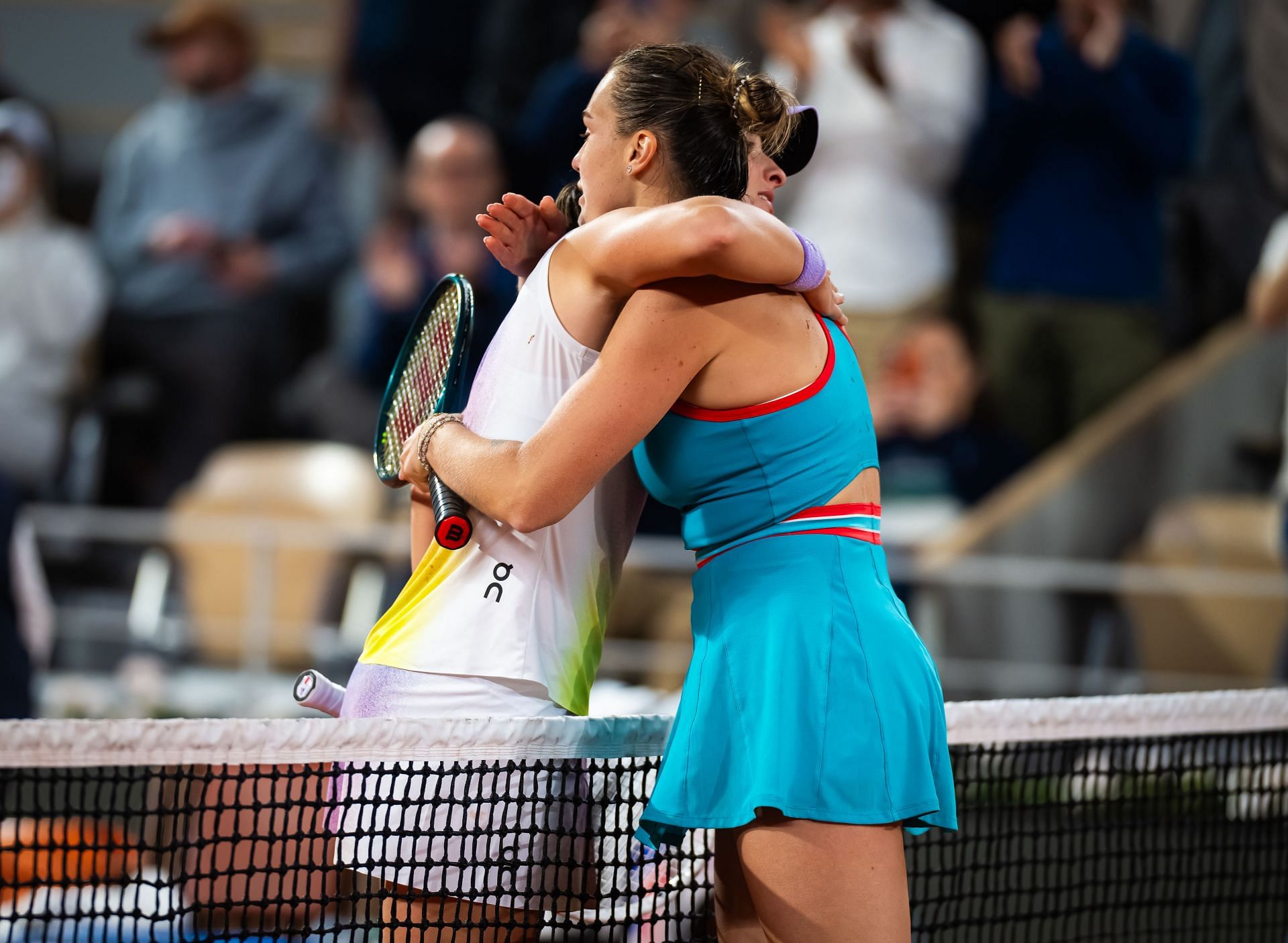 Aryna Sabalenka and Iga Swiatek embrace at 2025 French Open - Image Source: Getty