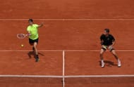 Joe Salisbury plays a volley at the 2025 French Open - Day Ten - Source: Getty