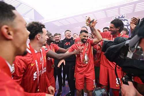 Mohamed Salah celebrates Liverpool's Premier League wn.
