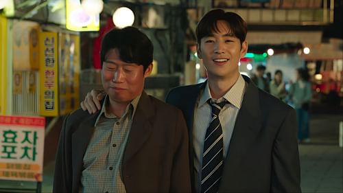 Choi In-beom (Lee Je-hoon) and Pyo Jong-rok (Yoo Hae-jin) share a rare moment of camaraderie outside the office in Big Deal (Image via Well Go USA Entertainment)