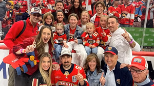 PIC: Brad Marchand's soon-to-be sister-in-law Heather shares a victory cigar with Stanley Cup champ after Panthers' win