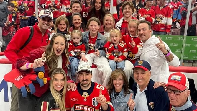 PIC: Brad Marchand's soon-to-be sister-in-law Heather shares a victory cigar with Stanley Cup champ after Panthers' win