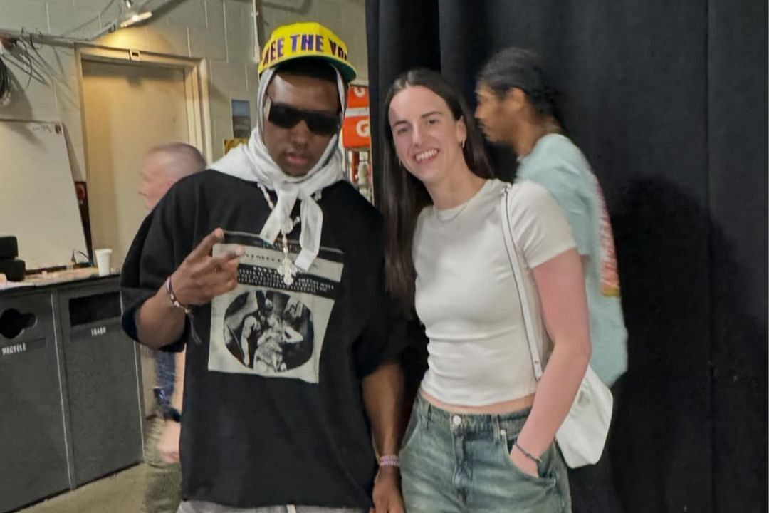 Rapper Rob49 poses for a picture with Indiana Fever star Caitlin Clark during Game 6 of the NBA Eastern Conference Finals