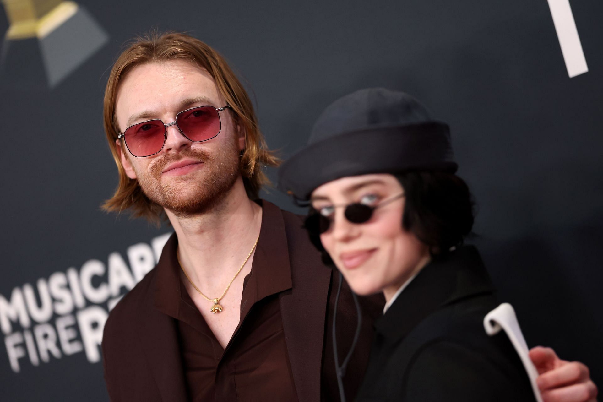 Finneas with his sister, Billie Eilish, at the 67th Annual GRAMMY Awards - Arrivals - (Image via Getty)