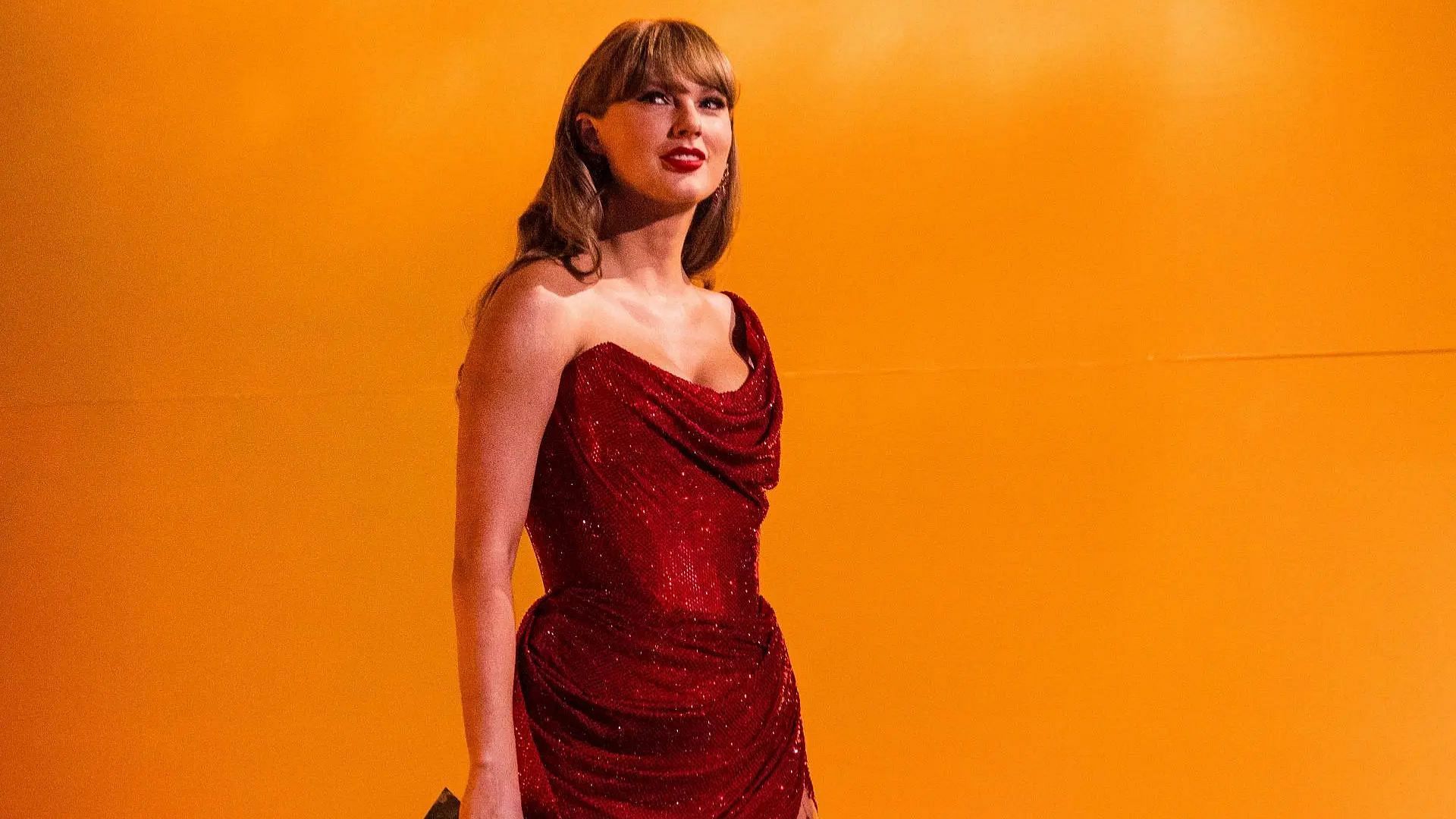 Taylor Swfit speaks onstage during the 67th Annual GRAMMY Awards at Crypto.com Arena (Image via Getty)
