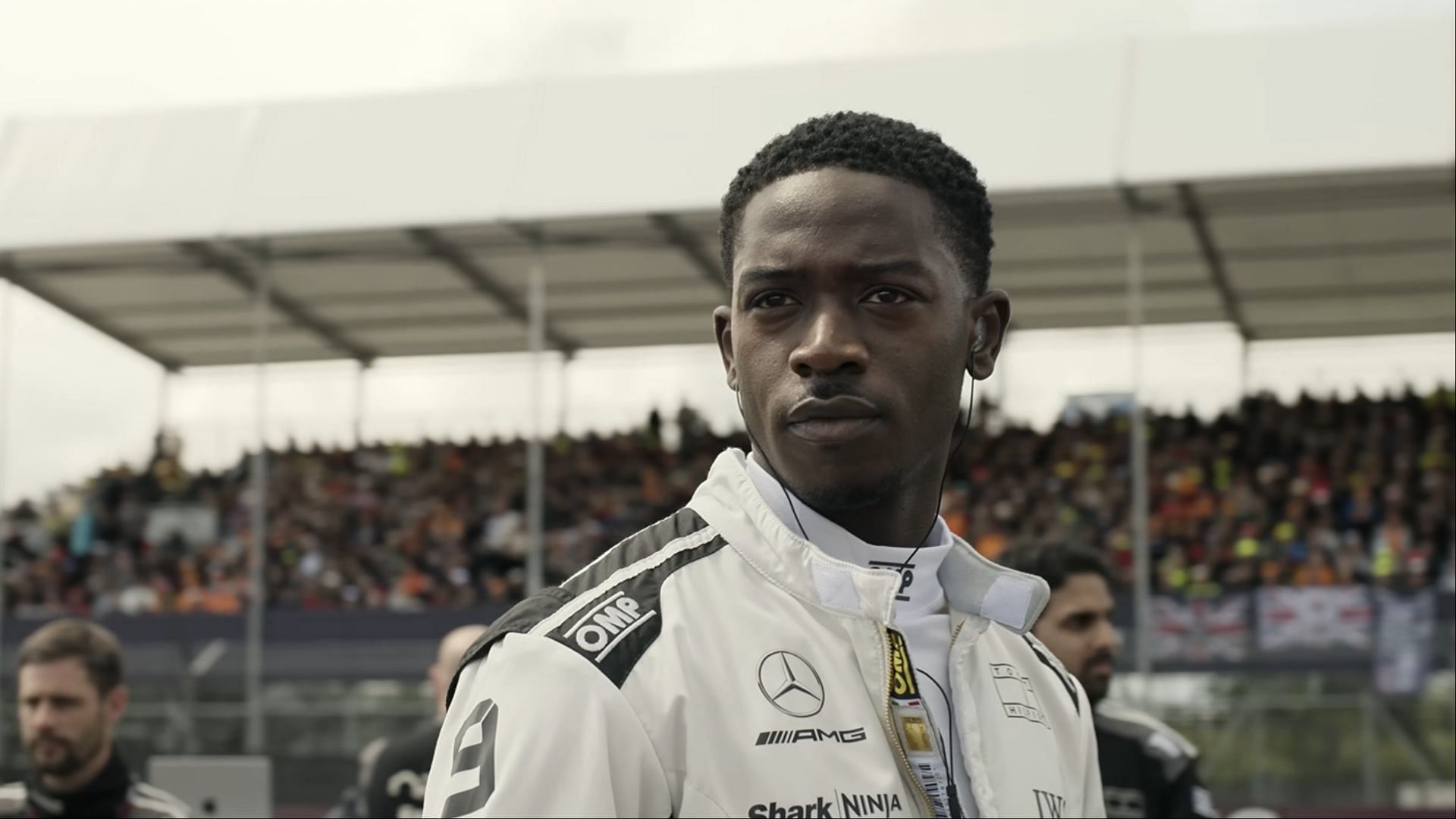Damson Idris as Joshua 'Noah' Pearce prepares for the grid in F1: The Movie, filmed at real Formula 1 circuits. (Image via AppleTV)