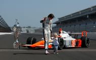 Dan Wheldon (L) and Sebastian Wheldon (R) at the 2011 Indianapolis 500 Mile Race Champions Portrait Session - Source: Getty