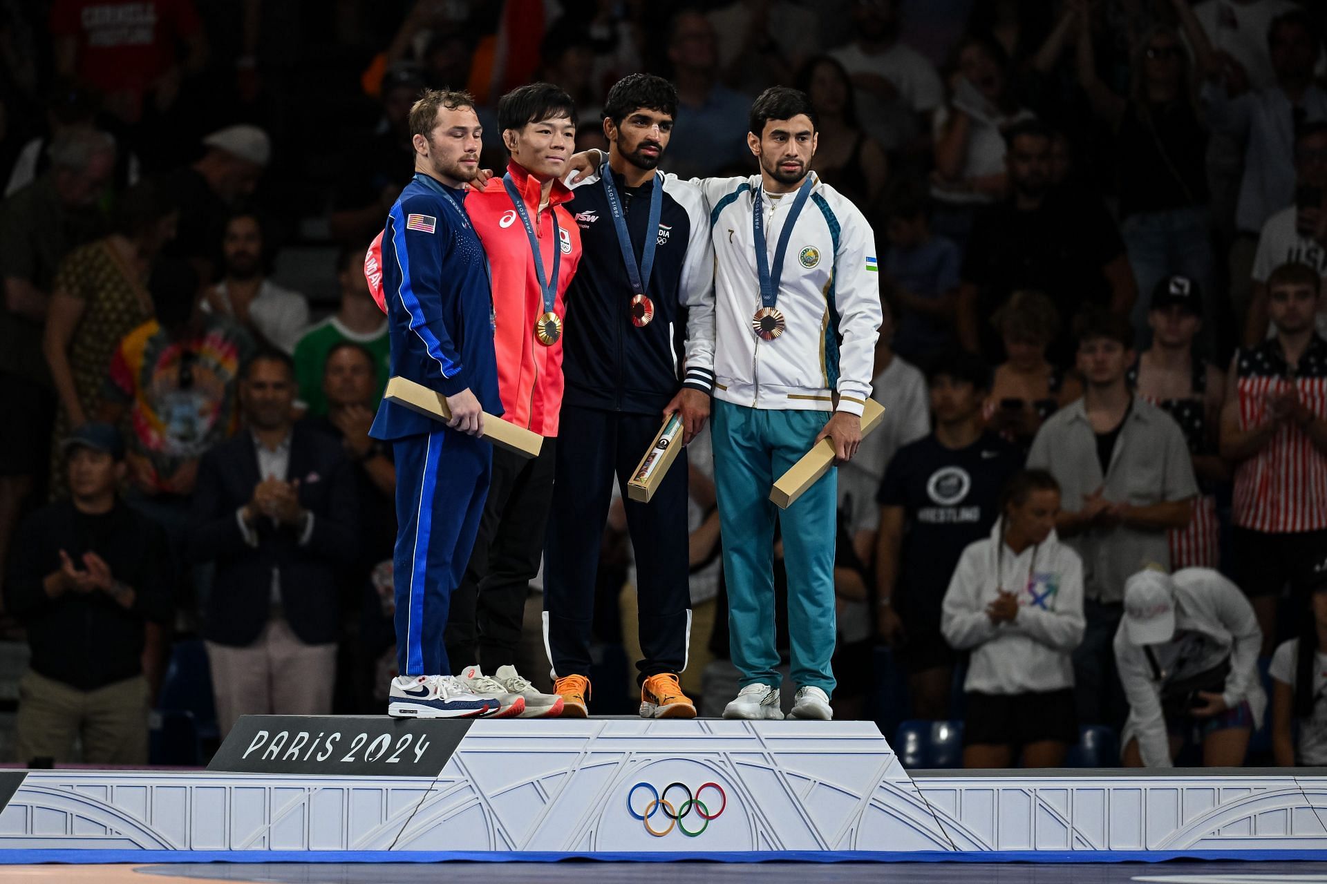 Spencer Lee [Extreme Left] at the medal ceremony for Men&#039;s 57kg. freestyle wrestling at Paris Olympics 2024 [Image Source : Getty]