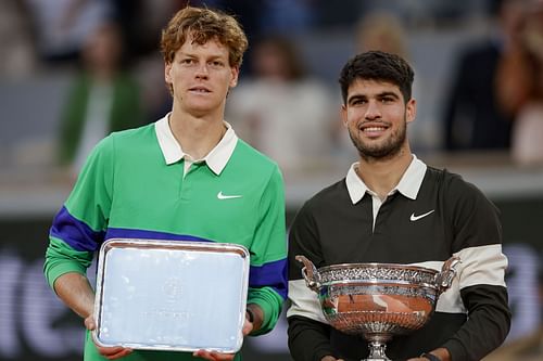 Jannik Sinner (left) and Carlos Alcaraz (right) during the men's singles trophy presentation ceremony at the 2025 French Open (Source: Getty)