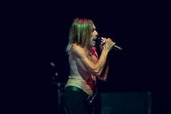 Legendary rocker Iggy Pop performs shirtless, gets wheeled off stage in a coffin during concert farewell