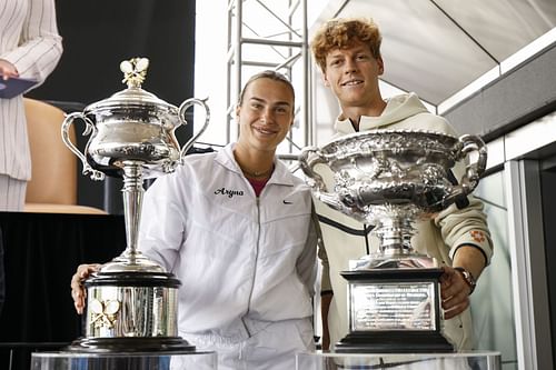 Aryna Sabalenka and Jannik Sinner with their Australian Open trophies - Source: Getty