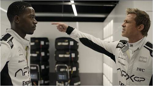 Damson Idris and Brad Pitt in F1: The Movie, portraying an intense moment between rookie driver Joshua Pearce and mentor Sonny Hayes. (Image via AppleTv)