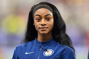 Sha'Carri Richardson reacts to Georgia's Track & Field head coach Caryl Smith Gilbert taking charge of Team USA at the World Championships